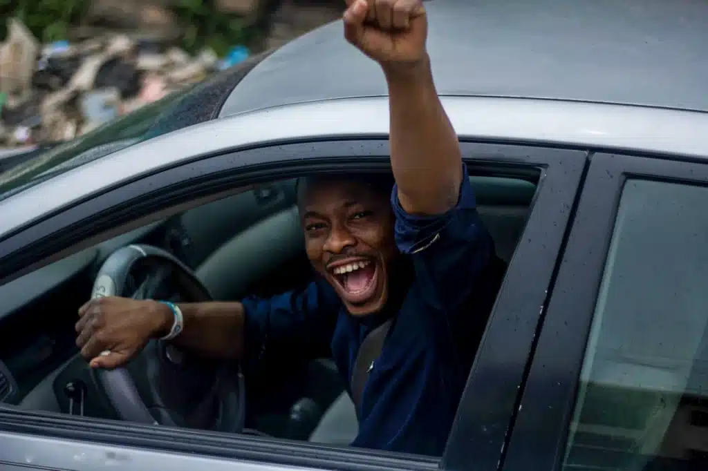 A person celebrating after winning a fight against a speeding ticket.