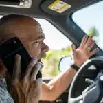 A frustrated driver yells as they are pulled over for talking on their cellphone in Calgary.