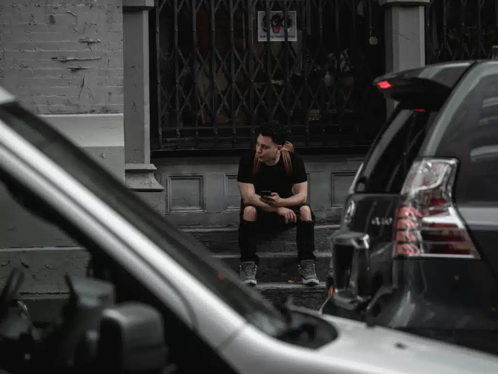 A person sits on a city stoop after receiving a traffic ticket in Calgary.