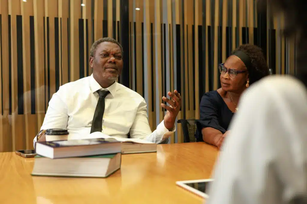 A traffic ticket expert explains options to a client in an office in Calgary.