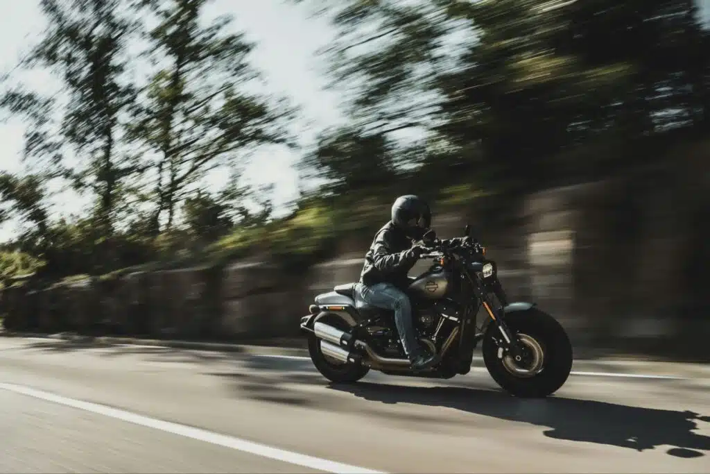 A person on a motorcycle speeds down a highway outside of Calgary.