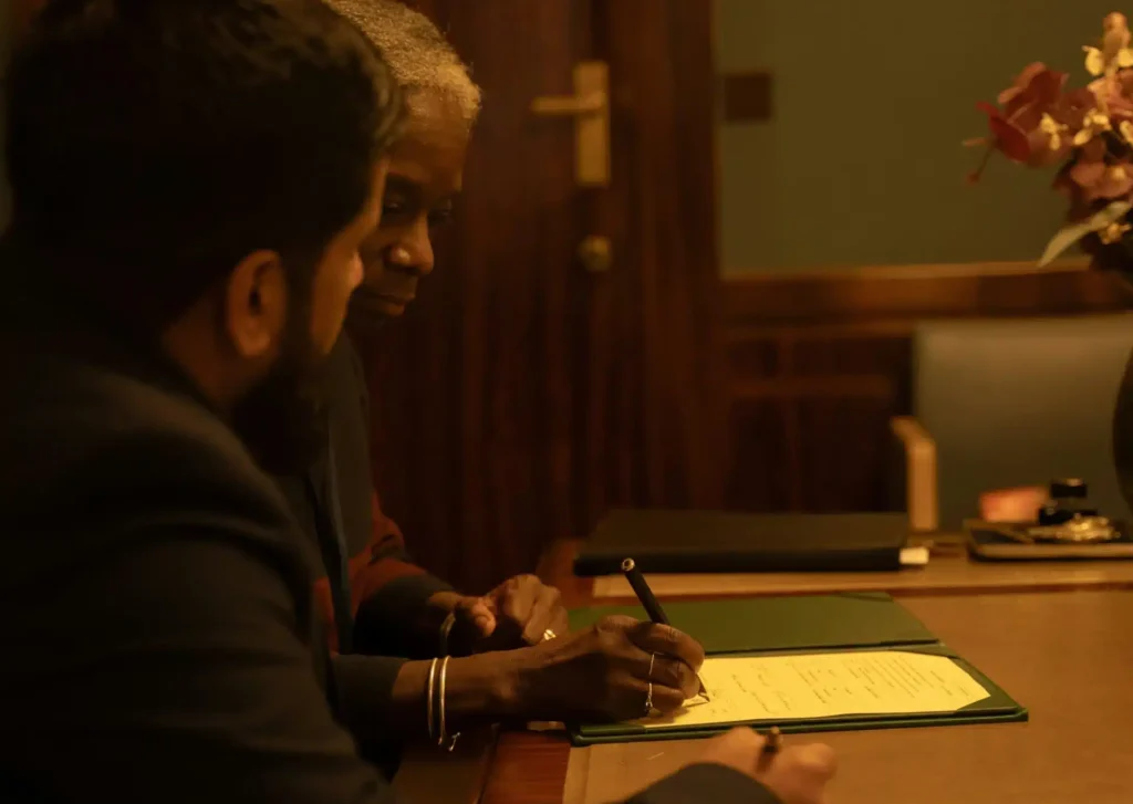 Someone who got a ticket in Alberta signs goes through the details of their ticket with a traffic ticket expert.